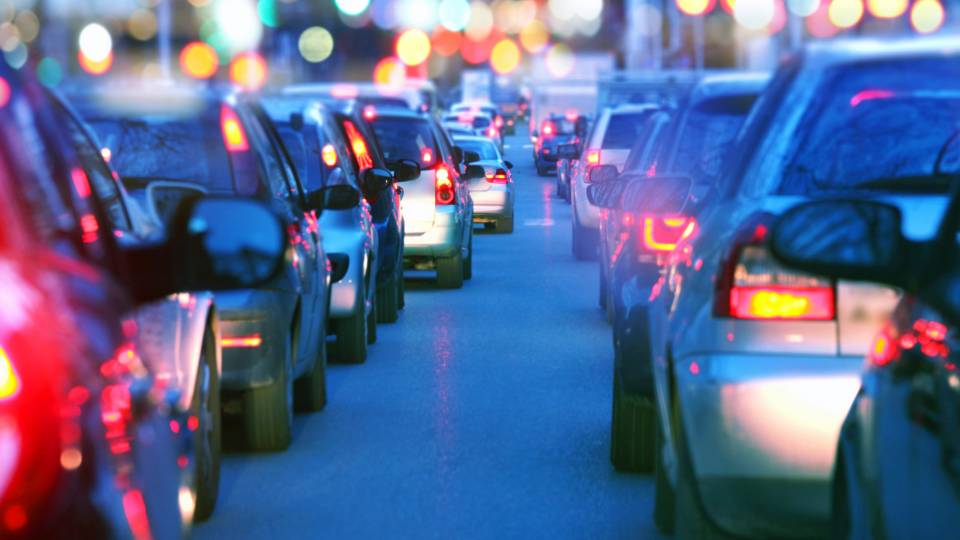 backs of cars in traffic