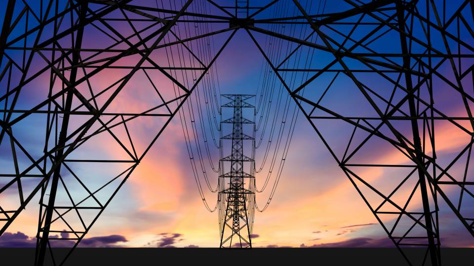 Power lines against a sunset