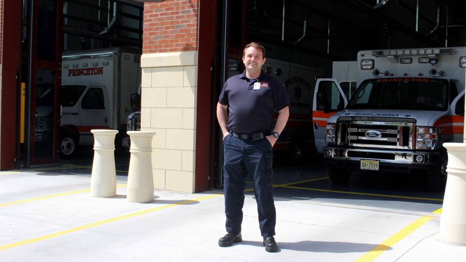 Eric Mills stands in front of the Princeton First Aid & Rescue Squad buliding