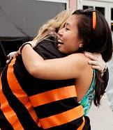 hugging alumni
