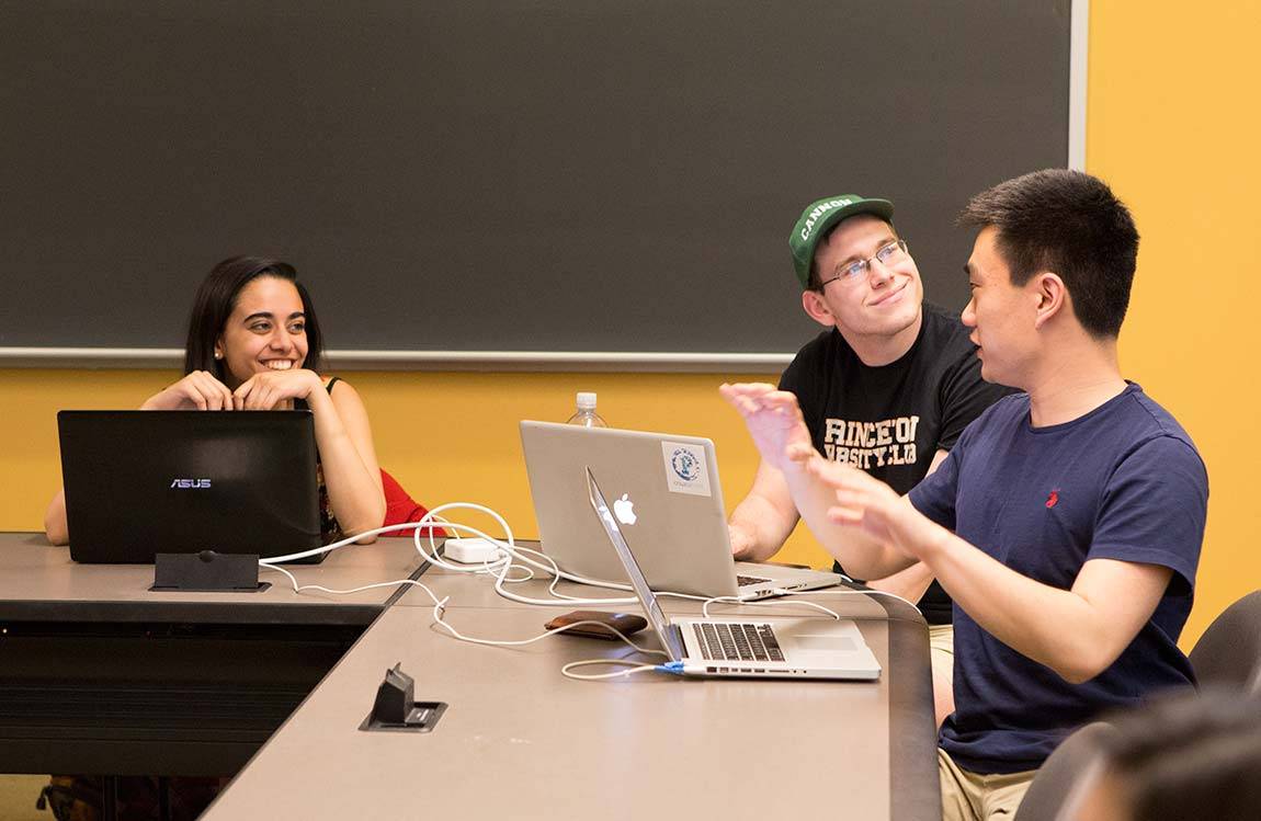 Students discuss in cybersecurity class