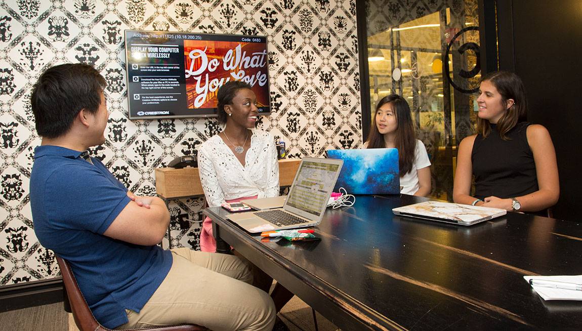 Princeton Start-Up Immersion Program Amos Chiou, digital strategist at Trendalytics, talks with juniors Victoria Scott, Denise Chan and Sarah Muse