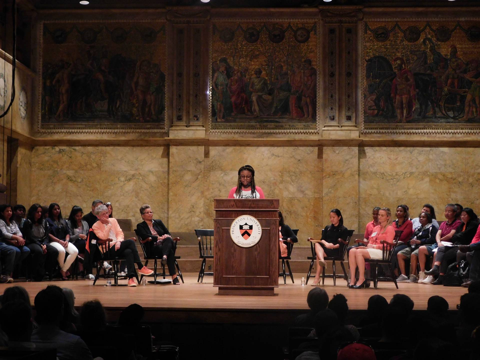 Myesha Jemison speaks to an audience family members during the Orientation welcoming program at Richardson Auditorium.&nbsp;