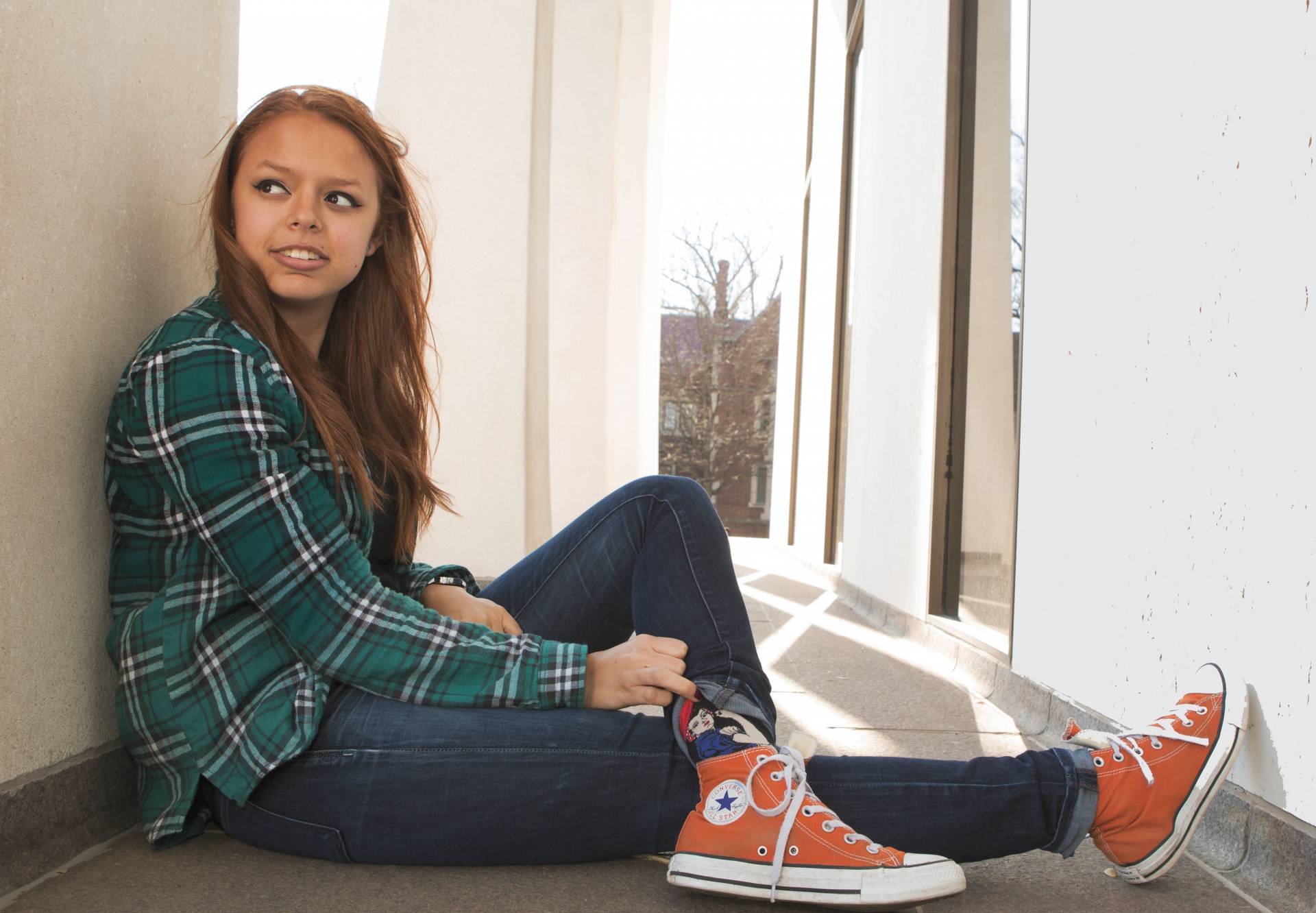 Peyton Lawrenz sitting outside Roberston Hall