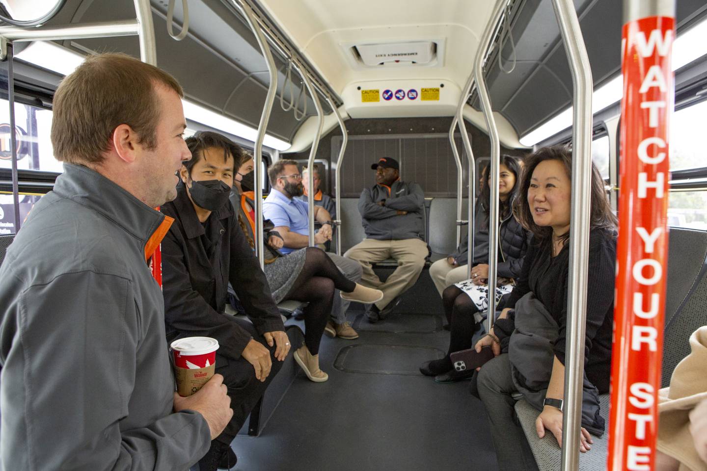 First people to ride the new EV bus